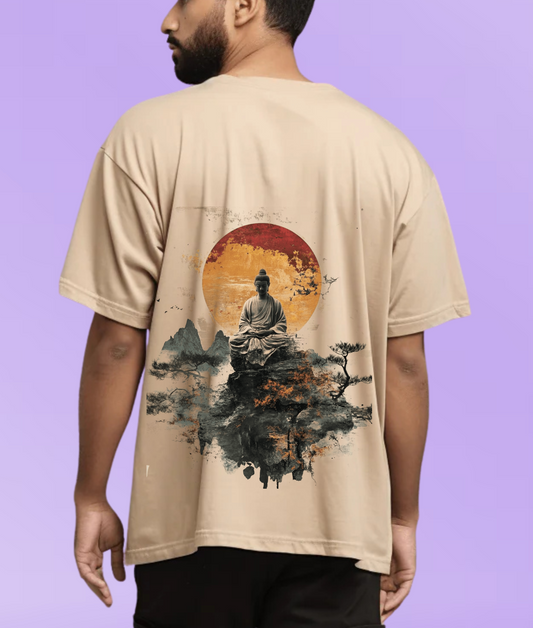 Back view of a person wearing a beige oversized 220 GSM t-shirt featuring a large graphic print of a meditating Buddha sitting on a mountain with a red sun background