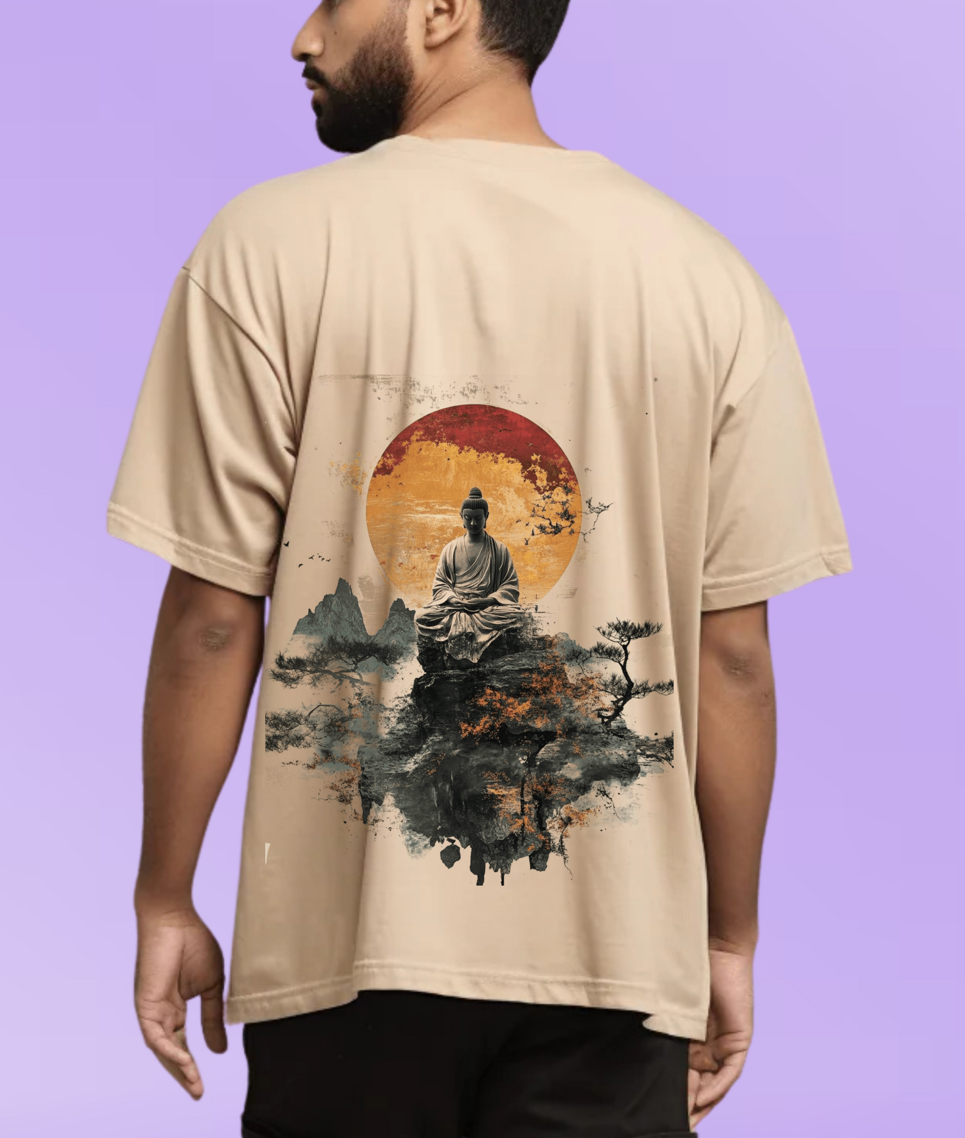 Back view of a person wearing a beige oversized 220 GSM t-shirt featuring a large graphic print of a meditating Buddha sitting on a mountain with a red sun background